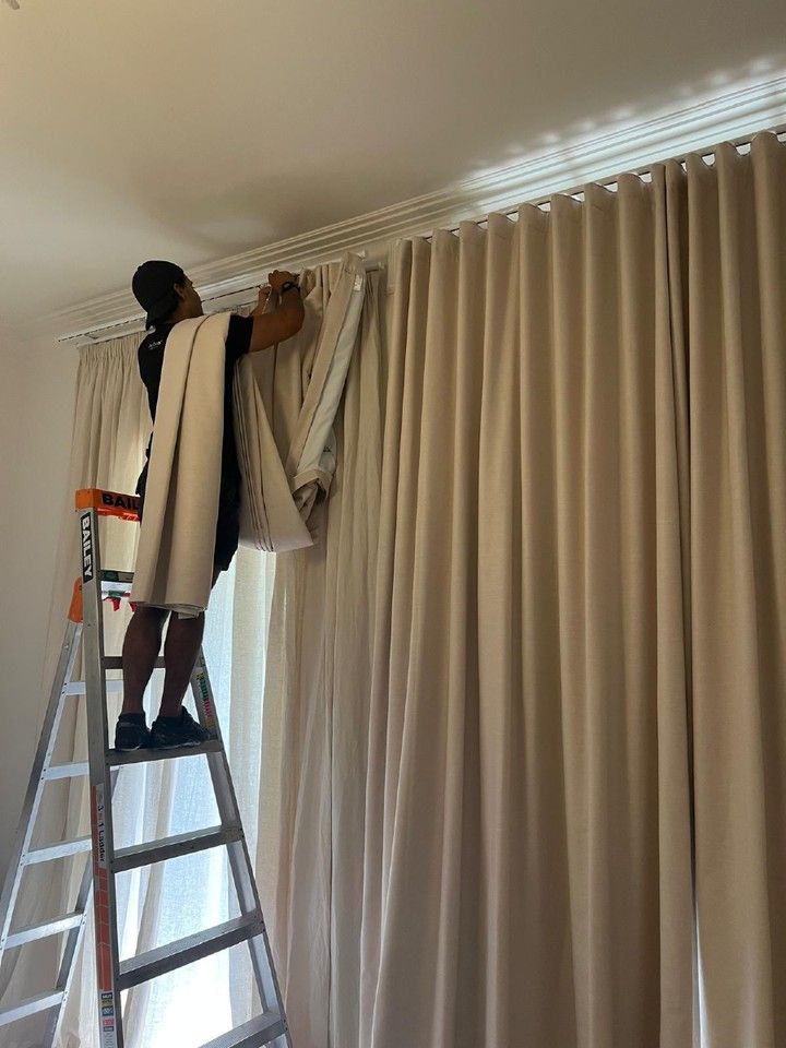 Curtain track installation on ladder